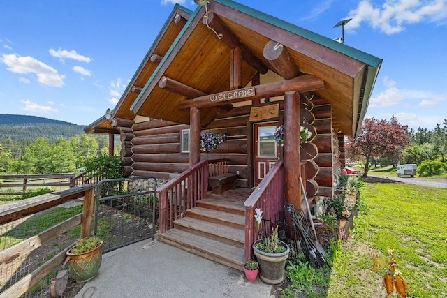 1427 Chapin Rd N, Evans, WA 99126 - entrance to property with log siding and a forest view