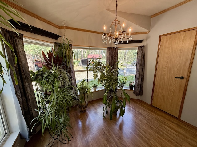 1874 Brooks Rd, Evans, WA 99126 - dining area with a chandelier, wood finished floors, healthy amount of natural light, and crown molding