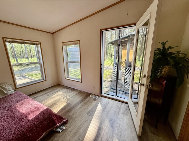 1874 Brooks Rd, Evans, WA 99126 - bedroom featuring vaulted ceiling, access to exterior, light wood finished floors, and crown molding