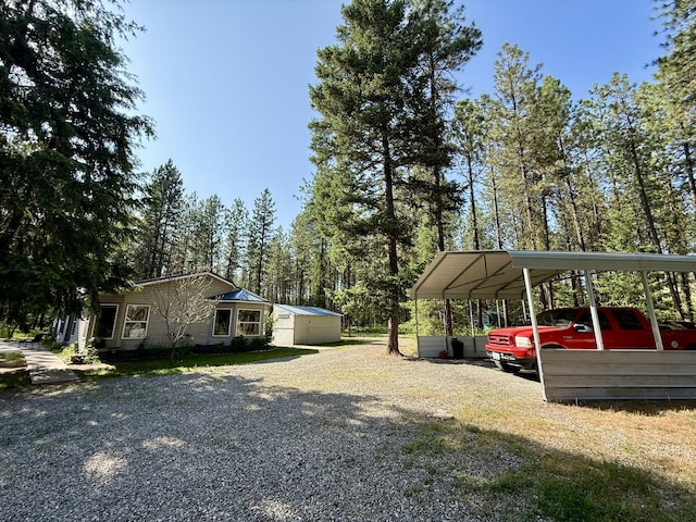 1874 Brooks Rd, Evans, WA 99126 - view of yard featuring a detached carport and gravel driveway