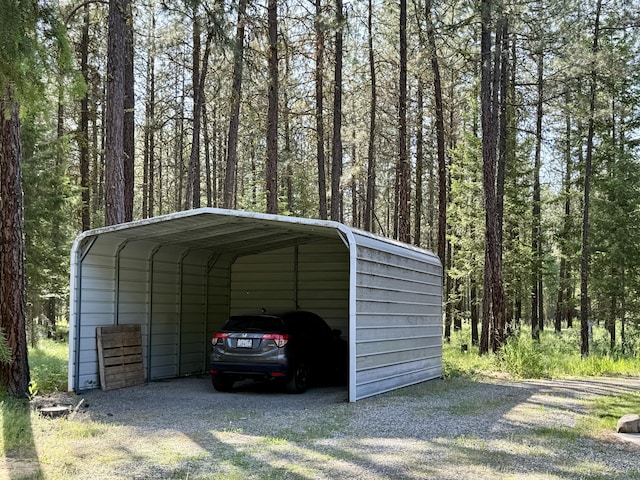 1874 Brooks Rd, Evans, WA 99126 - view of vehicle parking with a detached carport and a forest view