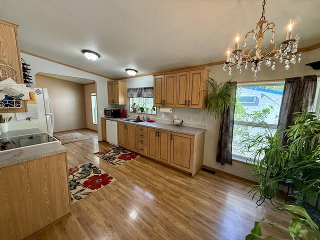 1874 Brooks Rd, Evans, WA 99126 - kitchen featuring white appliances, ornamental molding, light wood finished floors, light countertops, and a textured ceiling