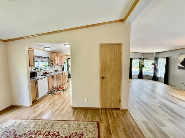 1874 Brooks Rd, Evans, WA 99126 - kitchen featuring dishwasher, stainless steel microwave, light wood-style floors, crown molding, and light countertops