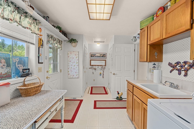 76 Kifer Rd, Kettle Falls, WA 99141 - kitchen with washer / dryer, light countertops, and light tile patterned floors