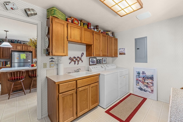 76 Kifer Rd, Kettle Falls, WA 99141 - laundry room with electric panel, separate washer and dryer, cabinet space, wallpapered walls, and light floors