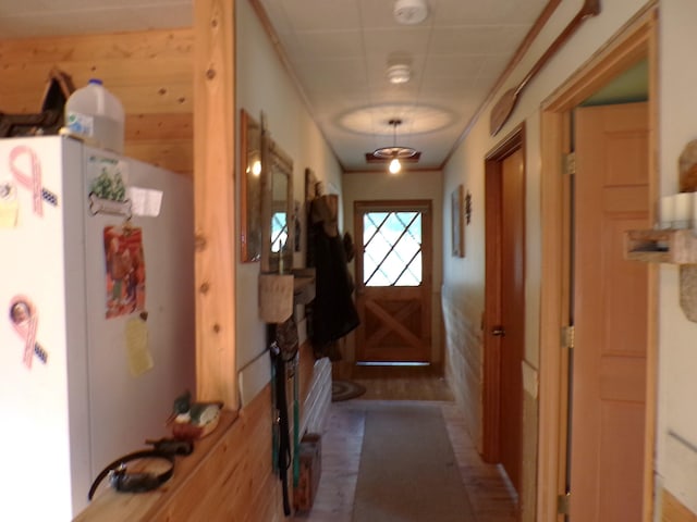 doorway to outside featuring ornamental molding