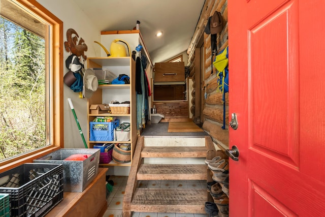 stairs with tile patterned flooring and a wealth of natural light