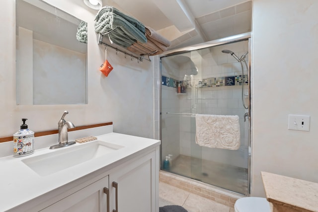 full bathroom featuring vanity, toilet, tile patterned floors, and a stall shower