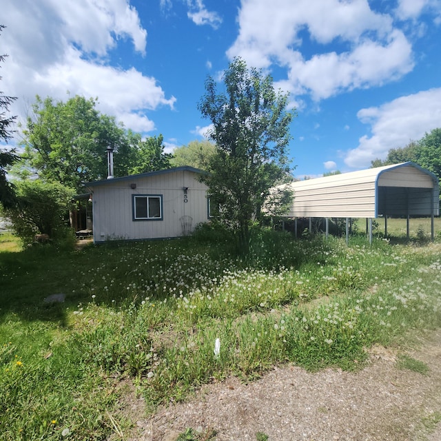 850 Narcissus St, Kettle Falls, WA 99141 - view of yard featuring a carport