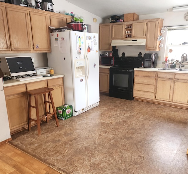 kitchen with white refrigerator with ice dispenser, light countertops, under cabinet range hood, black range with electric cooktop, and a sink