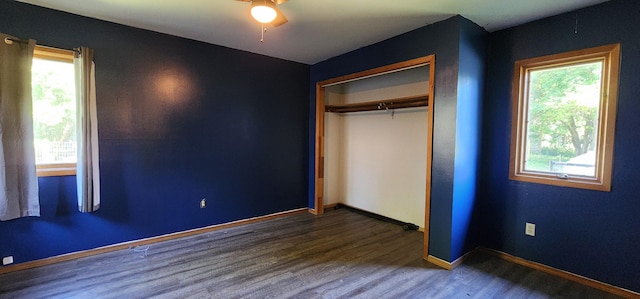 510 S Elm St, Colville, WA 99114 - unfurnished bedroom featuring wood finished floors, a closet, baseboards, and ceiling fan