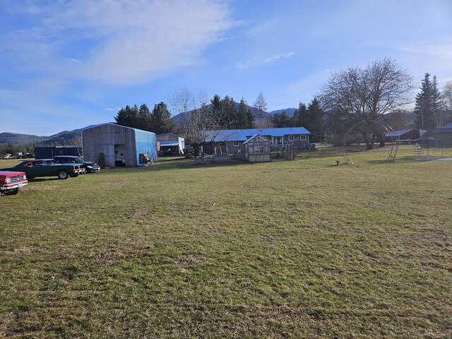 665 E Riverview Ln, Kettle Falls, WA 99141 - view of yard with a mountain view and an outbuilding