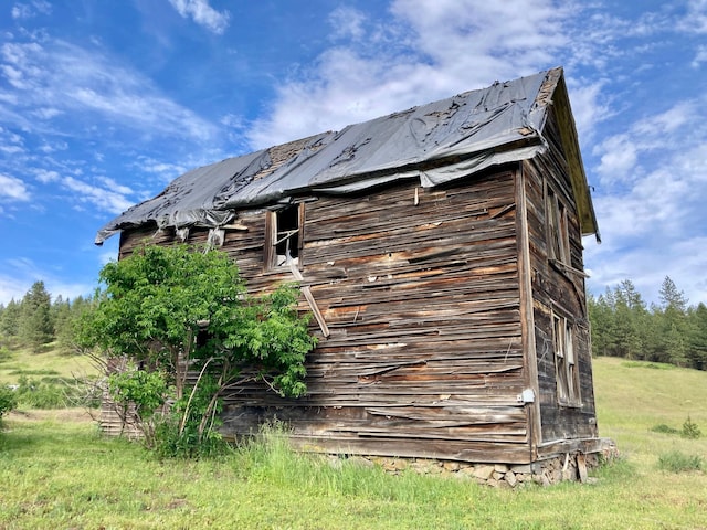 view of property exterior featuring an outbuilding