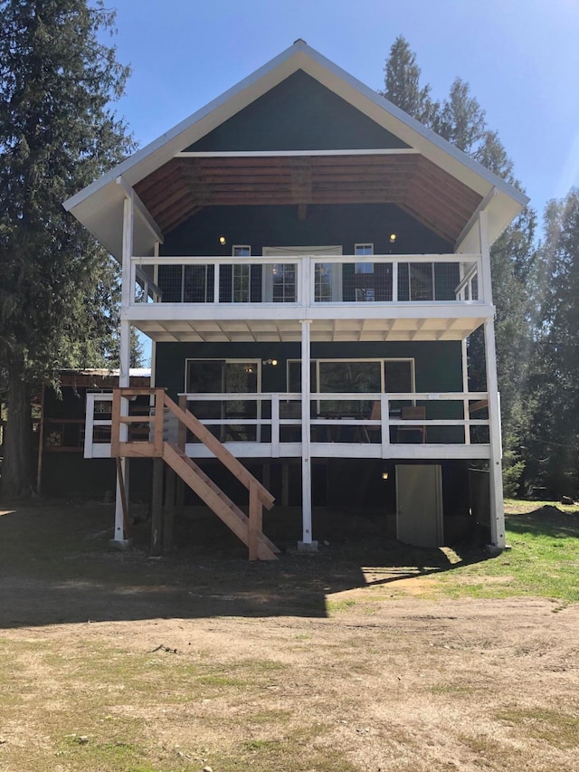 rear view of property featuring a balcony