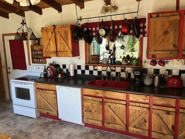kitchen featuring dark countertops, brown cabinets, a sink, beamed ceiling, and white appliances