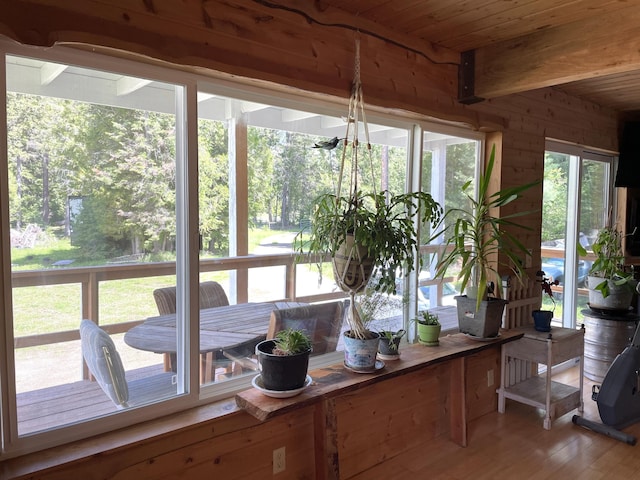 sunroom with beam ceiling