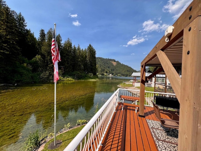 2851 Deep Lake Lopps Rd, Colville, WA 99114 - view of dock featuring a wooded view and a water view