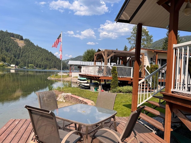 2851 Deep Lake Lopps Rd, Colville, WA 99114 - dock area with a lawn, a water view, and a forest view