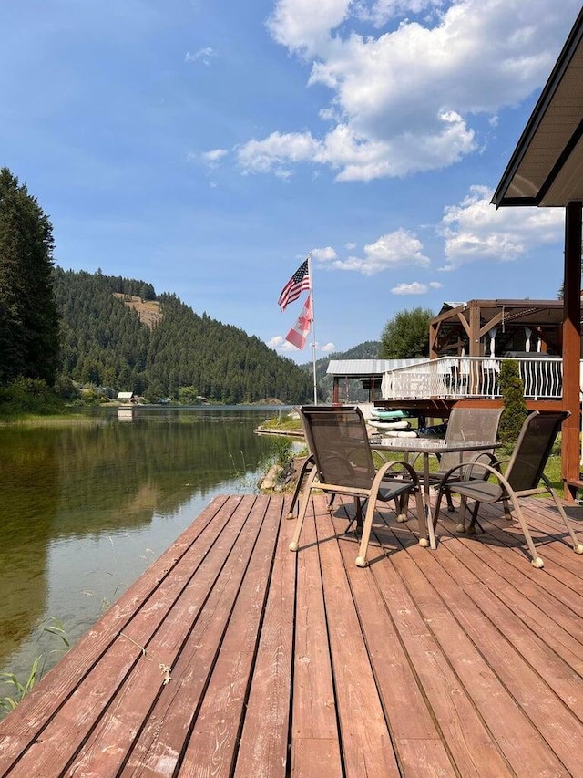 2851 Deep Lake Lopps Rd, Colville, WA 99114 - dock area with a wooded view and a water view