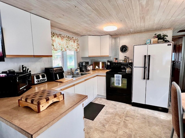 2851 Deep Lake Lopps Rd, Colville, WA 99114 - kitchen with black appliances, white cabinetry, light countertops, and wooden ceiling