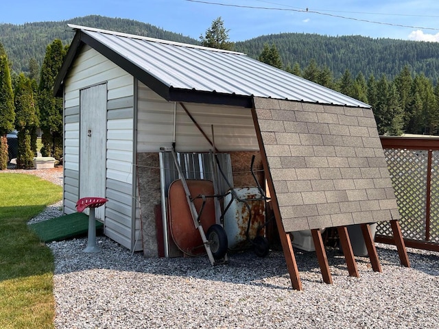 2851 Deep Lake Lopps Rd, Colville, WA 99114 - view of outbuilding with an outdoor structure, a mountain view, and a wooded view