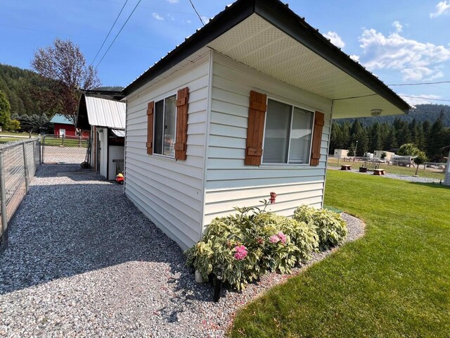 2851 Deep Lake Lopps Rd, Colville, WA 99114 - view of property exterior with fence and a yard