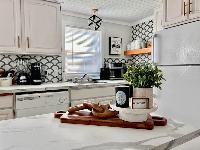2851 Deep Lake Lopps Rd, Colville, WA 99114 - kitchen with white appliances, decorative backsplash, white cabinets, and a sink