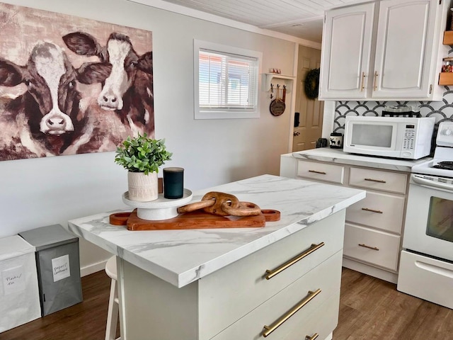 2851 Deep Lake Lopps Rd, Colville, WA 99114 - kitchen featuring dark wood-type flooring, white cabinets, ornamental molding, and white appliances
