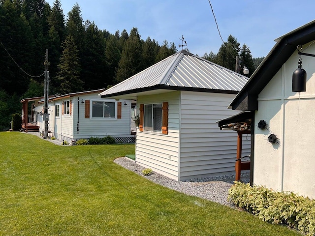 2851 Deep Lake Lopps Rd, Colville, WA 99114 - view of side of property with metal roof and a lawn