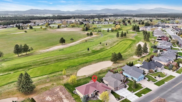 bird's eye view with view of golf course, a residential view, and a mountain view