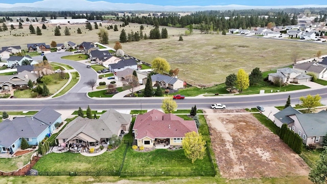 birds eye view of property featuring a residential view and a mountain view