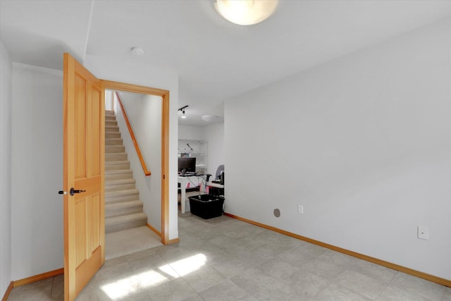 interior space featuring baseboards