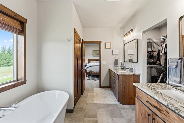 31914 N Zander Ln, Chattaroy, WA 99003 - ensuite bathroom with two vanities, a soaking tub, and a spacious closet