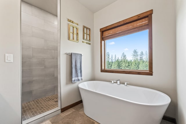 31914 N Zander Ln, Chattaroy, WA 99003 - full bath with a freestanding bath, plenty of natural light, a tile shower, and baseboards