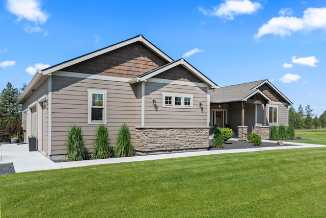 31914 N Zander Ln, Chattaroy, WA 99003 - craftsman inspired home with a front lawn, stone siding, an attached garage, and driveway