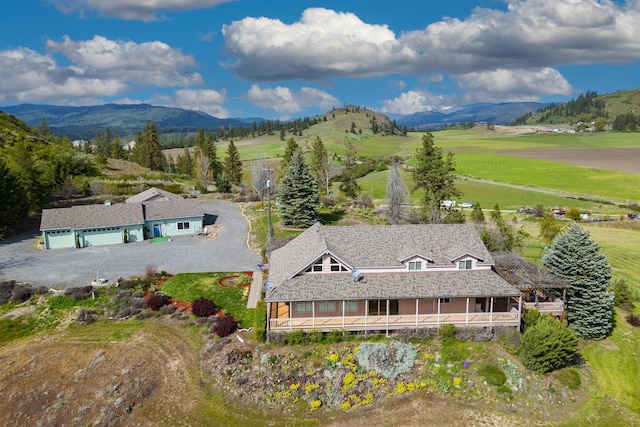 bird's eye view with a mountain view and a rural view