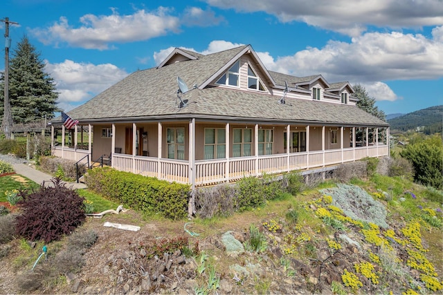 view of side of property with covered porch