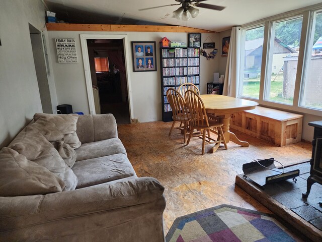 living room with ceiling fan and lofted ceiling