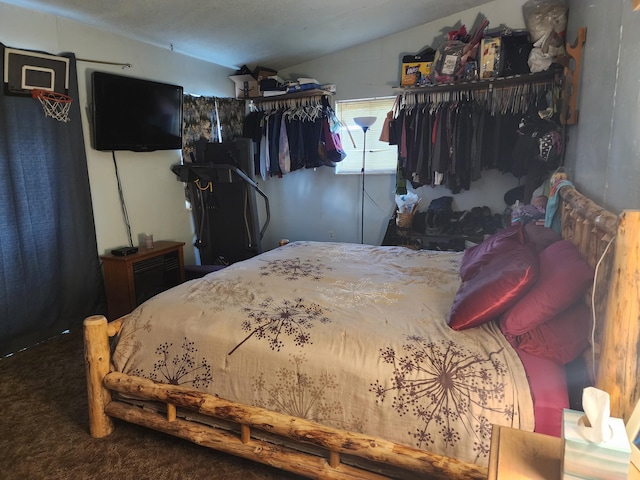 carpeted bedroom with vaulted ceiling