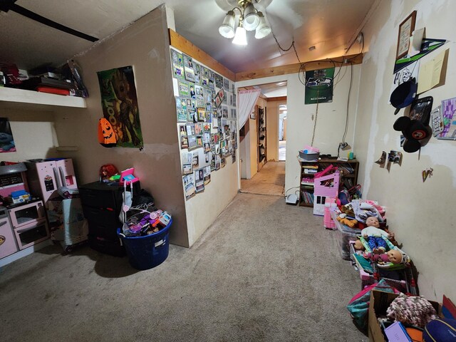 interior space featuring ceiling fan and light carpet