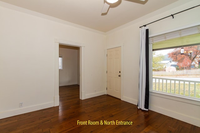 unfurnished room featuring ceiling fan and dark hardwood / wood-style floors