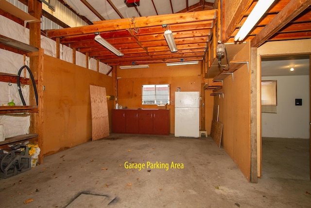 garage featuring white fridge