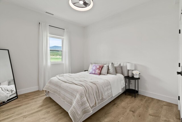 2419 Indian Ridge Rd, Chewelah, WA 99109 - bedroom featuring baseboards and wood finished floors