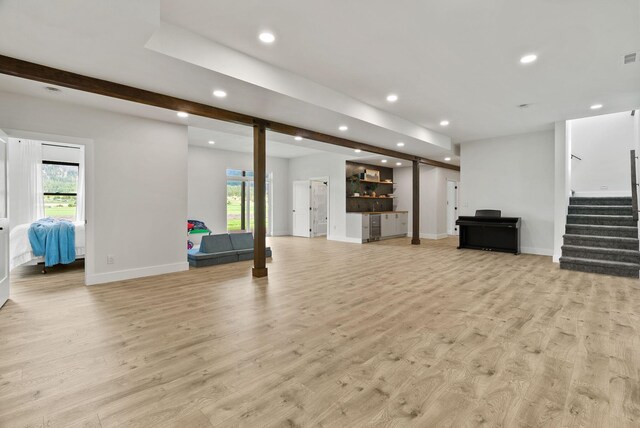 2419 Indian Ridge Rd, Chewelah, WA 99109 - unfurnished living room with recessed lighting, stairs, light wood finished floors, baseboards, and bar