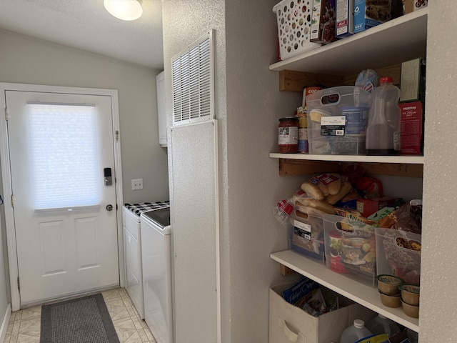 laundry room with washer and clothes dryer