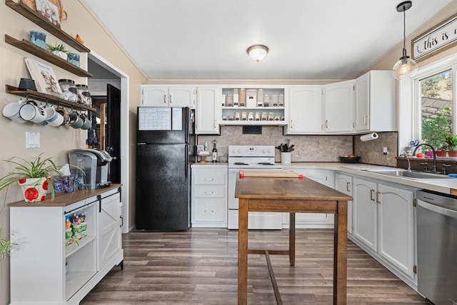 kitchen featuring stainless steel dishwasher, open shelves, white range with electric cooktop, and freestanding refrigerator