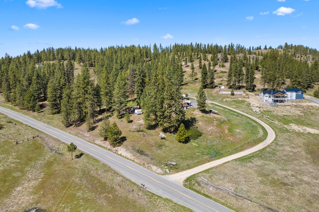 aerial view featuring a forest view
