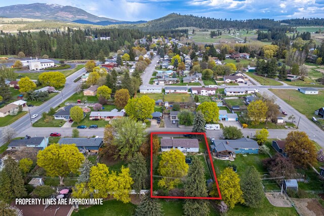 bird's eye view featuring a residential view and a mountain view