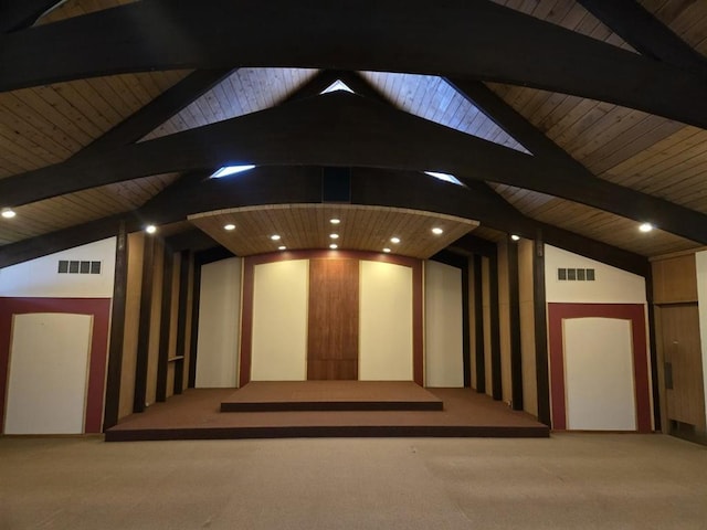 interior space featuring carpet, visible vents, wood ceiling, and vaulted ceiling with beams