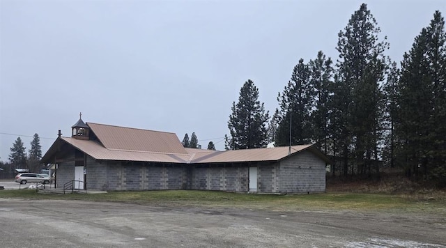 view of home's exterior with metal roof